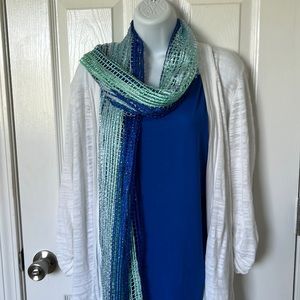 Blue stretchy tank top with white sweater and scarf